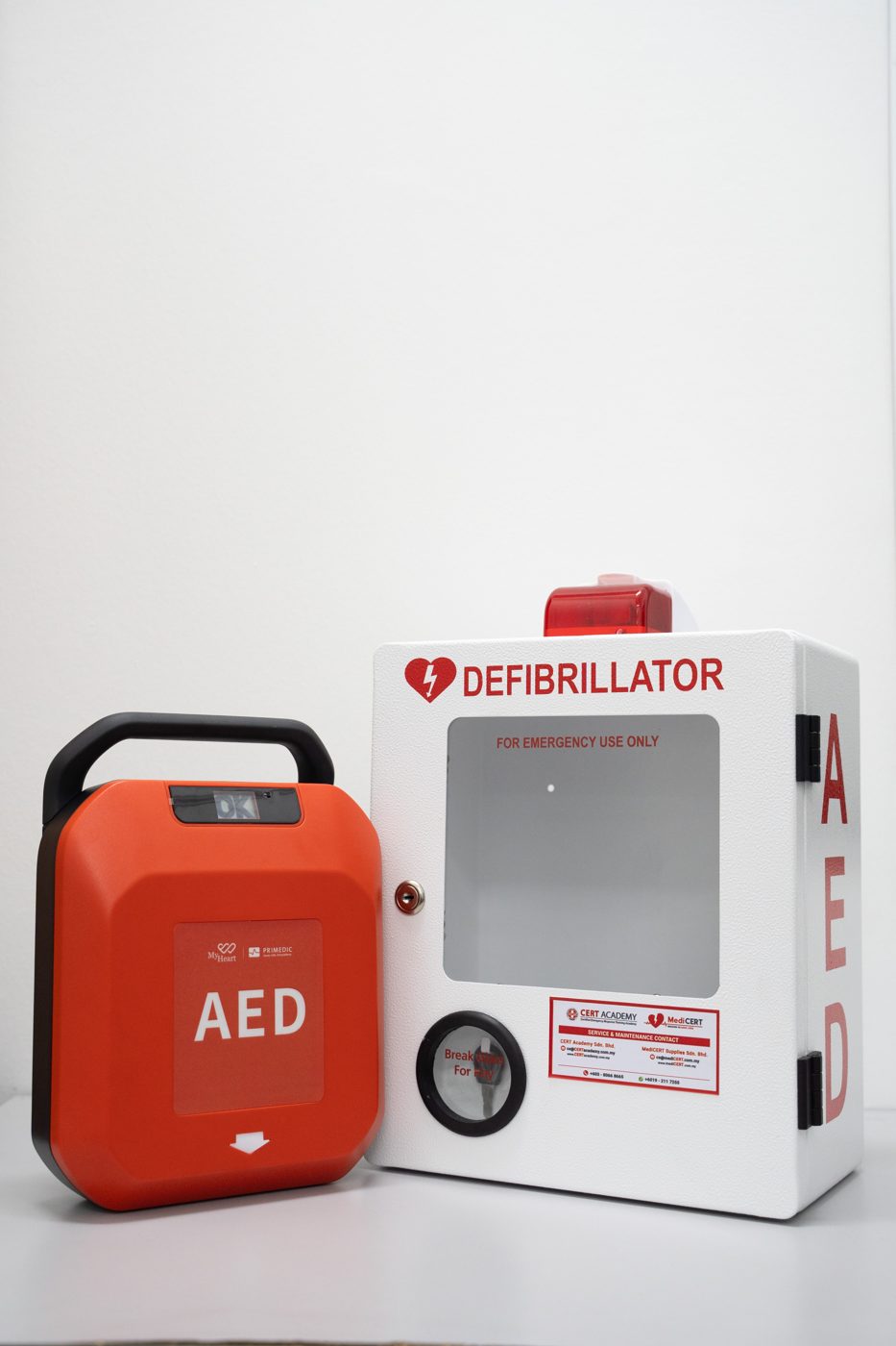 MyHeart Primedic S-Series AED with cabinet and AED signage