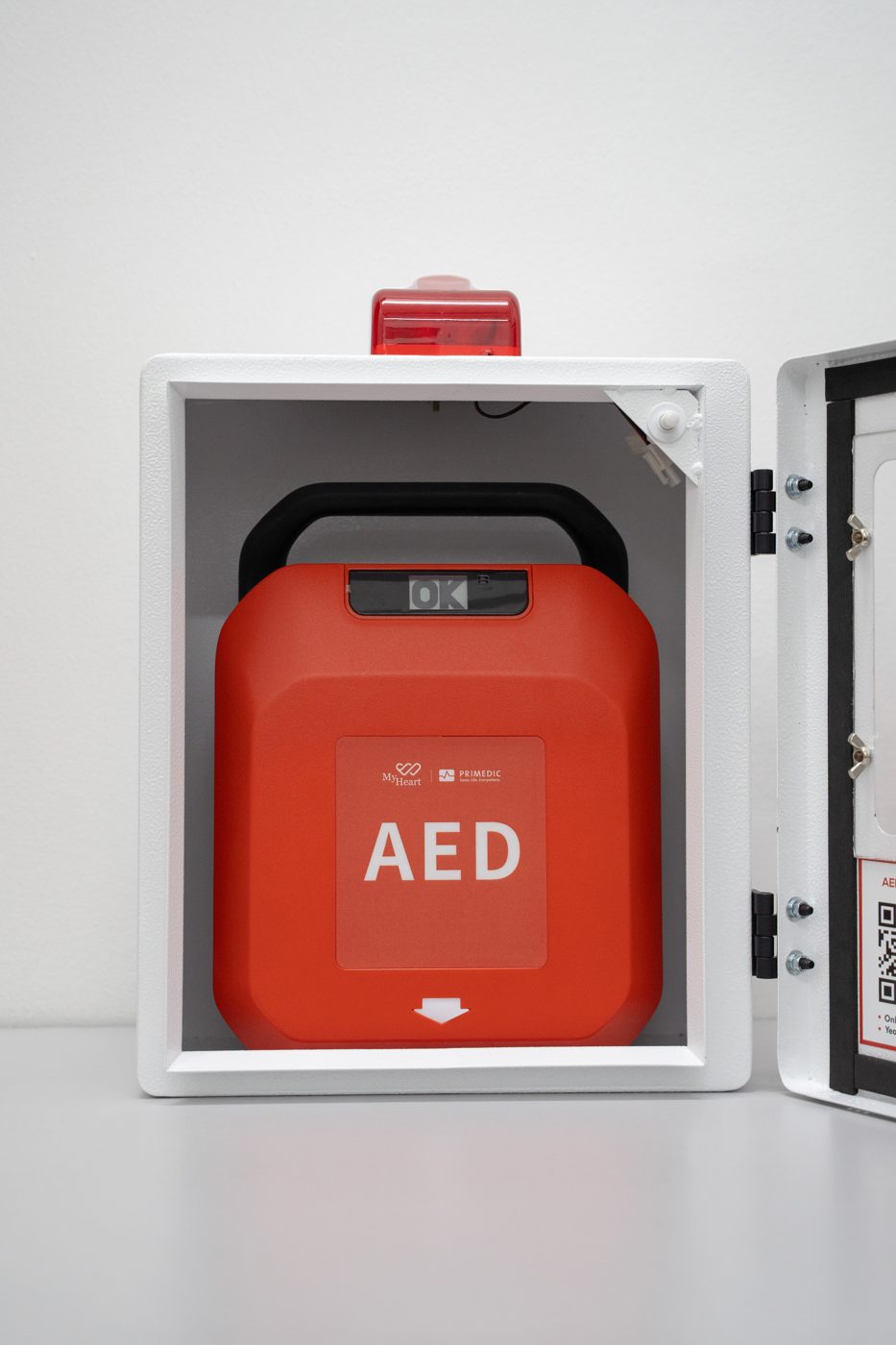 MyHeart Primedic S-Series AED inside an AED cabinet