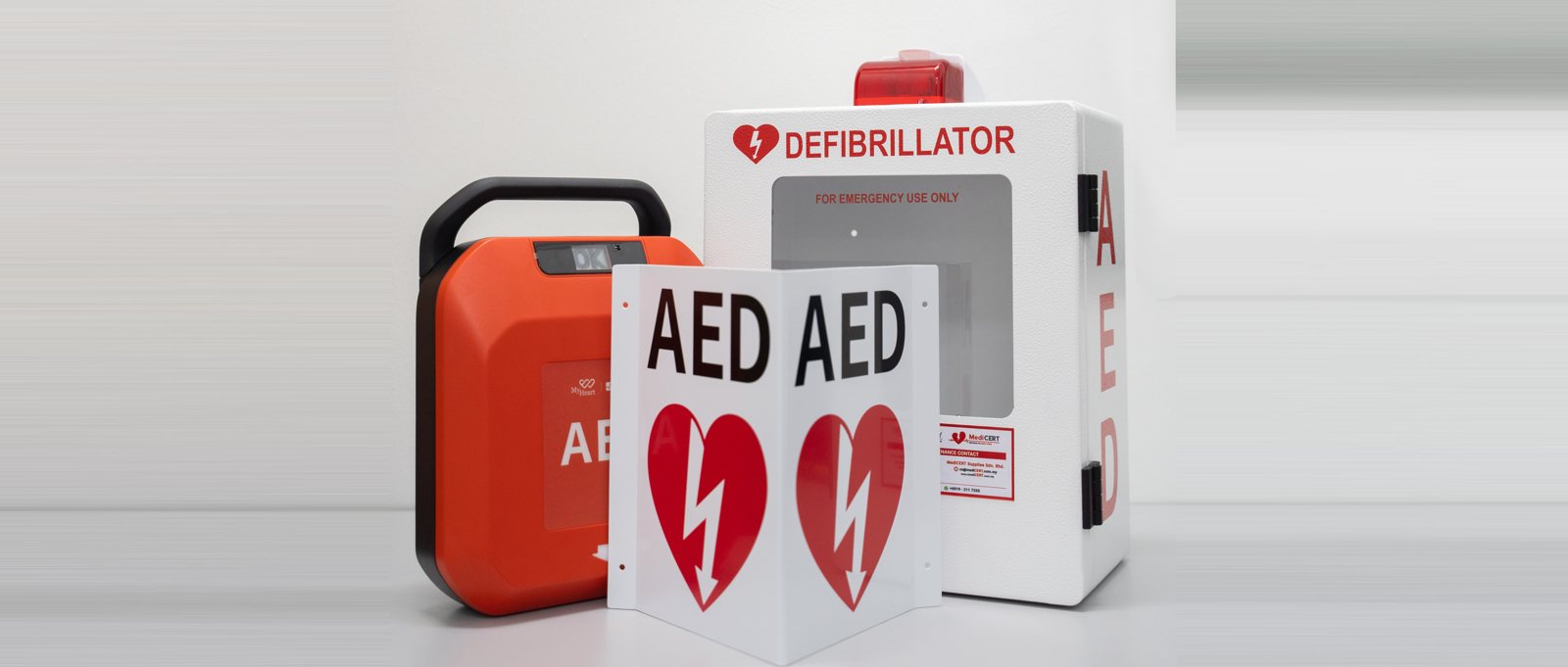 MediCERT AED package: MyHeart Primedic S-Series AED with AED cabinet and AED signage